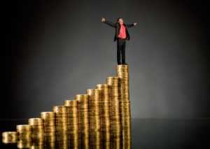 http://pas-wordpress-media.s3.amazonaws.com/wp-content/uploads/2013/08/Man-Standing-on-Stack-of-Coins-1024x726.jpg